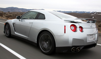 A three-quarter rear view of a silver 2009 Nissan GT-R on the track at the Reno-Fernley Raceway in Nevada