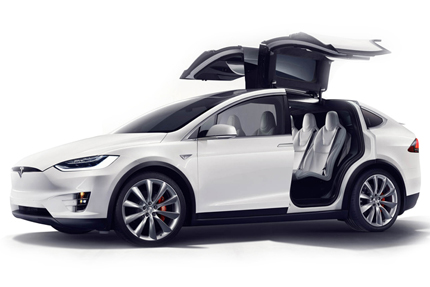 A side angle view of the 2016 Tesla Model X with falcon wing doors