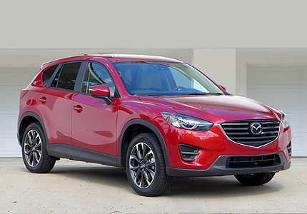 A three-quarter front view of a 2016 Mazda CX-5 SUV, one of GAYOT's Top 10 Value Cars