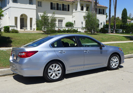 A three-quarter rear view of a 2015 Subaru Legacy 2.5i Premium sedan