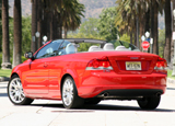 A three-quarter rear view of a red 2008 Volvo C70 T5 A three-quarter rear view of a red 2008 Volvo C70 T5
