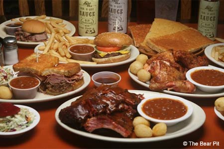 Since the 1950s, The Bear Pit has maintained a loyal following for its hickory-smoked barbecue, including baby-back ribs and generous sandwiches.