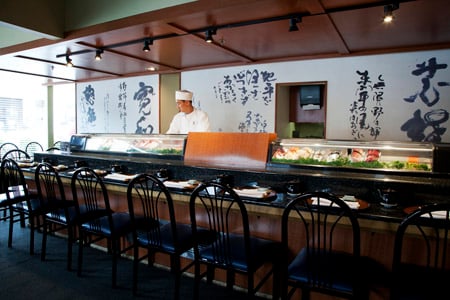 Bustling sushi bar scene with ocean-fresh fish and no gimmicks.