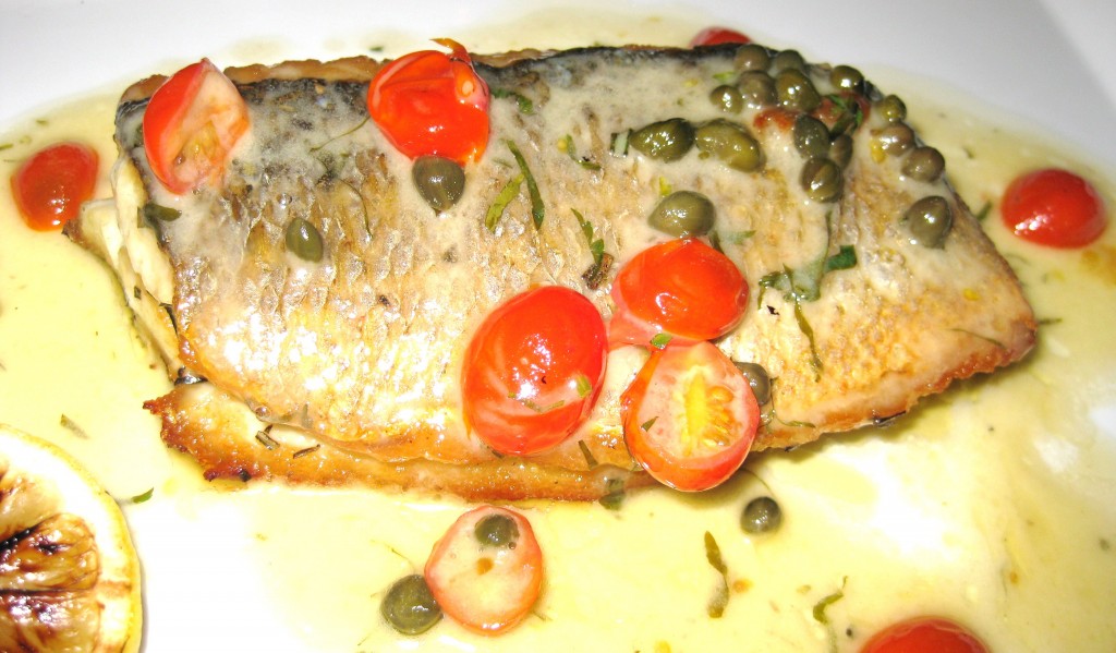 Branzino with tomatoes, capers & lemon