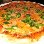 Margherita pizza with buffalo mozzarella, basil & tomato sauce on a wheat crust