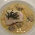 John Dory fillet poached in Malabar black pepper-citrus butter with cannelloni beans, marin velouté