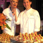 Chef Jonathan Wood from Park Grill, Los Angeles, handing a foie gras lollipop to Sophie Gayot