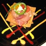 Ceviche tower; tower of tuna, halibut, salmon, yellowtail, gyoza skin, jalapeños, red and green onions
