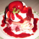 English Trifle: a light sponge cake layered with vanilla custard cream, raspberries and fresh whipped cream