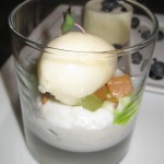 Coconut rice pudding with summer melon sorbet and candied pine nuts