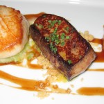 Diver scallops and foie gras with poached peaches, red wine reduction and almond streusel