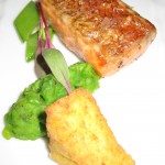 Tasmanian ocean trout baked in sea salt with cippolini, peas, mint and crispy polenta