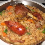 Cassoulet de Toulouse with duck confit, Toulouse sausage, pork belly, tomato, white bean and carrot stew, onions and bread crumbs
