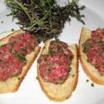 Steak tartare with capers, anchovies, shallots, parsley, egg yolk, Dijon, Tabasco sauce, Cognac, Worcestershire sauce