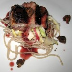 Peppered pork belly with buckwheat soba, pickled Savoy cabbage and cracklings