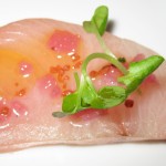 Raw yellowtail with zenzero oil and pickled red onion