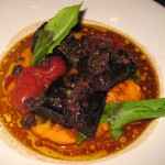 Braised beef daube with carrot purée, tomato confit and tapenade