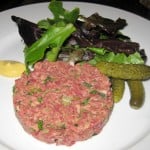 Steak tartare: handcut hanger steak with mesclun salad