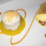 Spiced carrot cake with passion fruit cream, candied walnuts and coconut cream cheese ice cream
