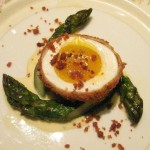 Green-egg and ham: olive oil-poached Delta asparagus with a crispy soft-boiled egg, prosciutto bits and Cambozola crema