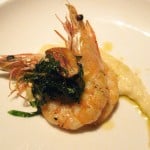 Grilled "angry" prawns: crispy garlic, basil, orange, Calabrian chili dressing and heirloom Toscanelli white beans