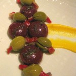 Aceitunas rellenas y aceitunas 'Ferrán Adria': olives stuffed with anchovy, piquillo and 'Ferrán Adria' liquid olives