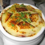 Soupe à l'oignon gratinée: French onion soup, melted Gruyère on a brioche croûton