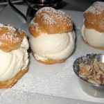 Classic profiteroles: vanilla ice cream topped with hot chocolate sauce