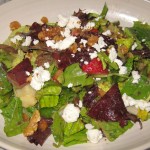 Spring chopped salad with snap peas, strawberries, walnuts, goat cheese and balsamic