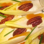 Roquefort terrine with caramelized pecans served on an endive with jus d'abricot