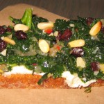 Crostini with kale, ricotta, pine nuts and currants