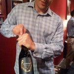Chris Towt of Dunstan Wines uncorking another bottle