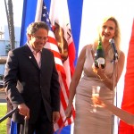 Sophie Gayot sabraging a bottle of Besserat de Bellefon Brut NV Champagne with Santa Monica mayor Richard Bloom