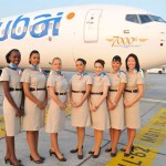 flydubai flight attendants stand near the 7000th Boeing 737 aircraft