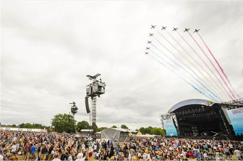 The British Royal Air Force's Red Arrows does its part in exciting the massive crowds by flying over the Isle of Wight Festival. (Photo courtesy of the Isle of Wight Festival. Click on the photo to go directly to the Isle of Wight website.)