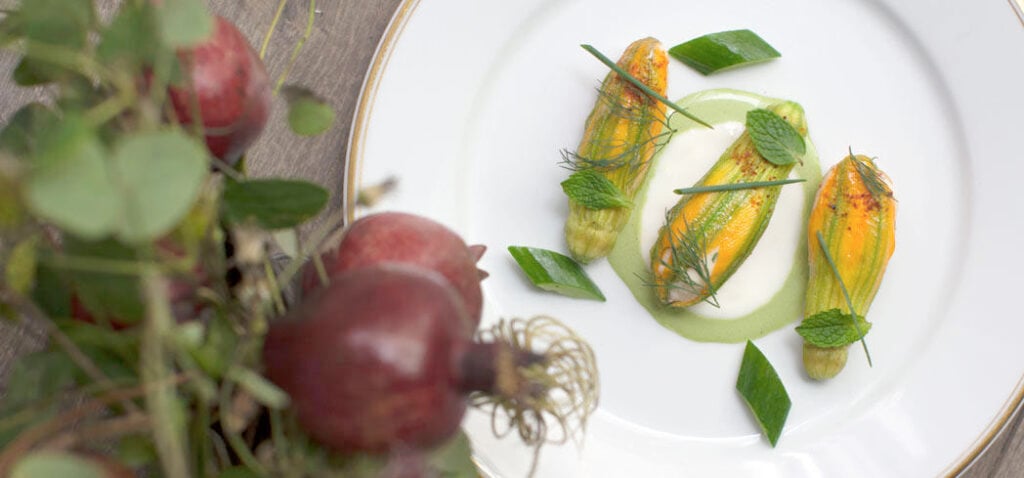 Lobster stuffed squash blossoms by chef Daniel Rose at Le Coucou, NYC (Photo by Corry Arnold)
