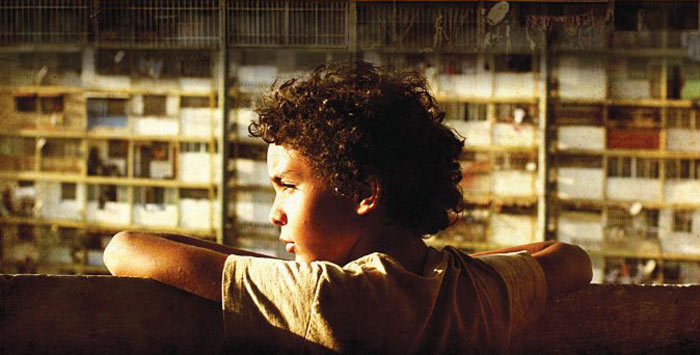 Samuel Lange Zambrano plays Junior in Pelo Malo