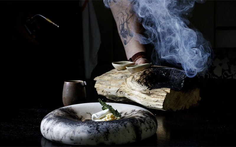 Palo Santo ice cream with marinated grilled pineapple, tamarind meringue and candied hoja danta | Photo credit: Allen Hemberger