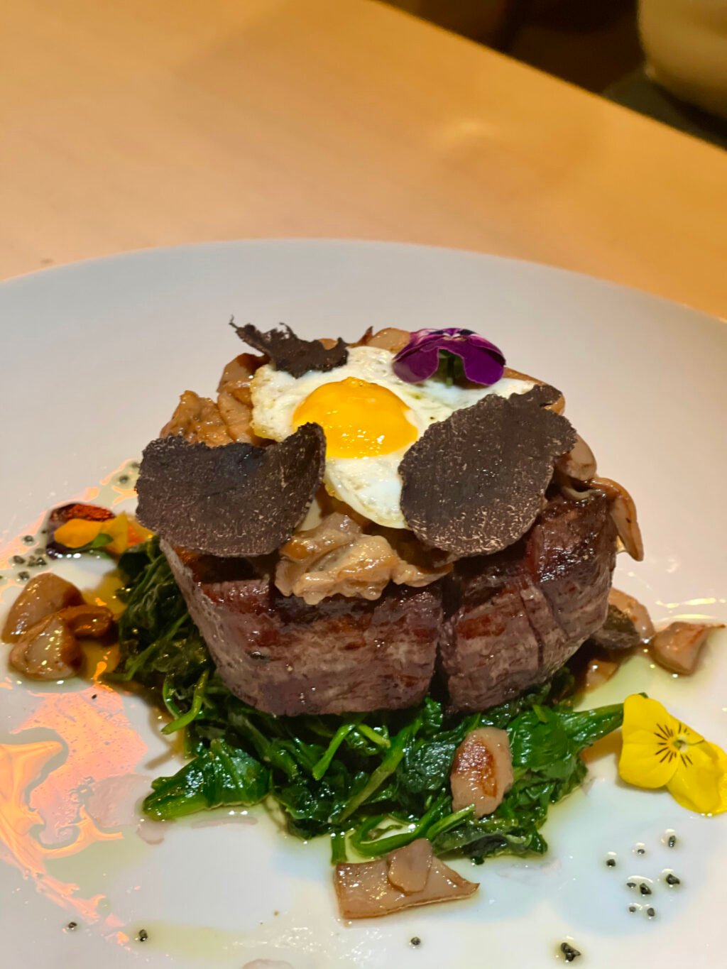 Filet mignon with mushrooms and quail egg
