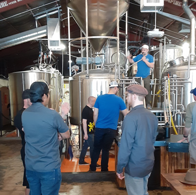 Several local brewers collaborate on brewing the Chris Curtis ALS Hops for Hope beer at Able Baker Brewing