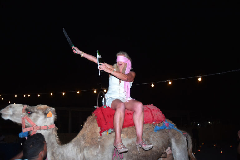 Sophie Gayot champagne sabrage blindfolded on a camel Marrakesh
